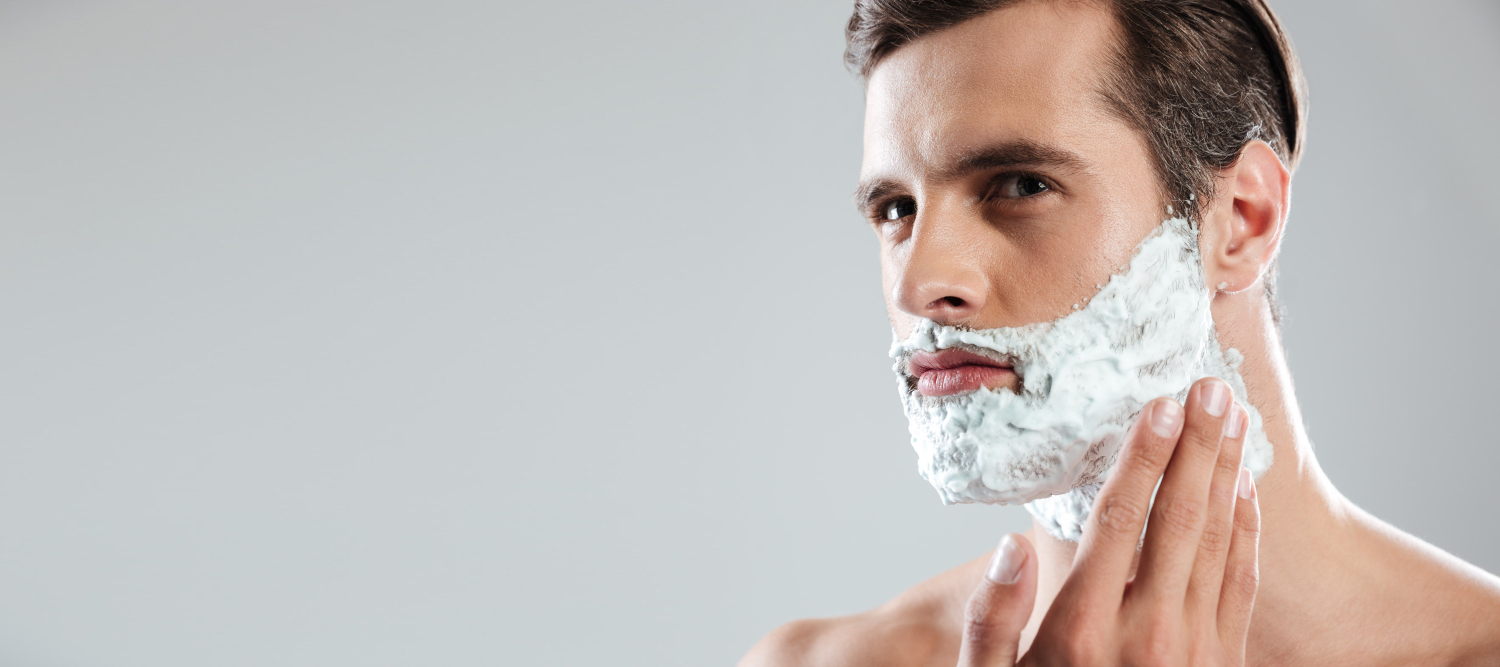 concentrated-man-standing-isolated-with-shaving-foam-face.jpg