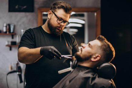 handsome-man-cutting-beard-barber-shop-salon